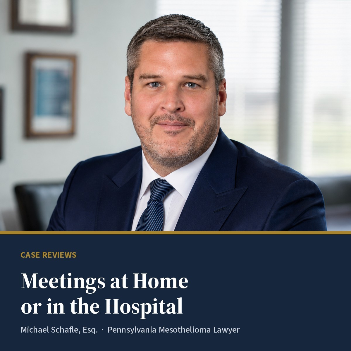 Michael Schafle, Esq., Pennsylvania mesothelioma lawyer, in a navy suit at his Philadelphia office, above a navy banner reading "Meetings at Home or in the Hospital".